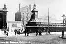 View: s16039 Fitzalan Square, 1890-1915. Omnibus waiting rooms, foreground, Bell Hotel and Wonderland entertainment booth in background