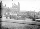 View: s16047 Fitzalan Square, 1895-1915, (l. to r.), Birmingham District and Counties Banking Co. Ltd., Wonderland entertainment booth, Bell Hotel and J. and F. Ibbotson, woollen merchants