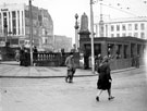 View: s16058 Fitzalan Square looking towards High Street including Nos. 51 - 55 Burton Montague Ltd., tailors, Transport Offices, foreground