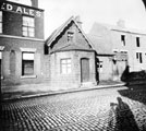 Victoria Hotel (later Victoria Vaults closed in the early 70's) and old toll bar house No. 329 (coal dealers),  Langsett Road  between Woodland Street and Victor Street