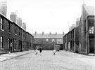Nos. 28-40 (right) and Nos. 33-49 (left), Girton Road, Brightside looking towards rear of housing on Attercliffe Common with No. 8 Higgitt Road visible (extreme right)