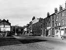 Nos. 35, Horace Jackson, betting shop, 33, A. Coulson, grocers, 31, 29, Jn. W. Hawsworth, newsagent etc., Gower Street, Burngreave looking towards Burngreave Road