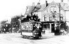 View: s16491 Tram No. 220 on Ecclesall Road at Hunter's Bar, No. 669 Sheffield Banking Co. on corner, Points boys shelter on right