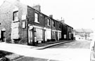 Market Street, Woodhouse, looking up towards the war memorial, hairdressers on left