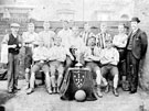 Unidentified cup winning football team, Mr. Whitmore, aged 18 (2nd from right back row), taken in Stackyard, Dunkirk Square, Darnall