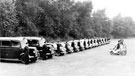 Inspection of transport at Niagara Sports Ground, front row Velocettes, rear two police vans (Black Marias), Austin patrol cars (first two Austin Cars) with 2 women civilian drivers