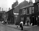 Harvest Lane looking towards Platt Street showing the Wheatsheaf Inn (left of picture) and No. 152, H. H. Sparks, newsagancy