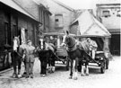 View: s16879 Last of the horses at the stables of Brightside and Carbrook Co-op., Broughton Lane Depot, showing 'Queenie' (centre horse), the milk floats and drivers, Mr. H. Chapman standing by the horses