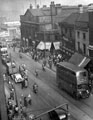 Elevated view of Haymarket, Norfolk Market Hall, Nos. 20 and 22 Burton Montague Ltd., tailors, No. 18 Lipton Ltd., tea merchants