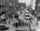 View: s16984 Haymarket looking towards Fitzalan Square and showing the construction of new F.W. Woolworth and Co. Ltd., left, premises on right include No. 21, Arthur Davy and Sons Ltd., Mikado Cafe and No. 25, Weaver to Wearer