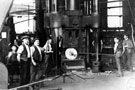 Tyre Mill, Samuel Fox and Co. Ltd., tyres being turned in the steam hammer, roughing out shape