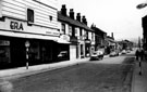 View: s17128 Hereford Street from The Moor, premises include Nos.1, 3 and 5 Era Furnishing Co. Ltd., house furnishers, No. 9 Strand Cafe, No. 11 Jn. Wm. Shaw and Son, bakers