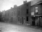Nos. 14 - 24 Hermitage Street. Premises include No.10 Montys Motor Exchange, secondhand motor car dealers and No. 18, Sandall and Woffinden, builders (where arch is). Court No. 2, at rear of back to back houses on right
