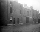 Nos. 14 - 24 Hermitage Street from junction of St. Mary's Lane. Premises include No. 18 Sandall and Woffinden, builders (where arch is)