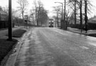 Herries Road at the junctions with Longley Lane (left) and Norwood Avenue (right), showing the bus shelter and police box