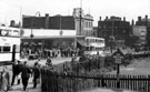 View: s17266 High Street looking towards Haymarket and Commercial Street, temporary C and A Modes Ltd., ladies outfitters, left, site of Marples Hotel, No. 4 Fitzalan Square, right, Yorkshire Penny Bank in background