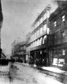 View: s17282 High Street, from Mulberry Street, prior to road widening, Nos. 48 - 50 Duncan Gilmour and Co., wine and spirit merchants and Clarence Hotel, Nos. 52 - 56 J. Walsh and Co., drapers