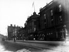 View: s17297 High Street, premises include Central Chambers (with flag), Nos. 35 - 37 Carlton Restaurant and public house, No 41, West End Clothiers' Co. Ltd., tailors and outfitters and Copestake, Crampton, and Co., warehousemen, No. 43 H. Samuel, watch maker
