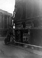 View: s17320 No. 80 High Street (corner of Change Alley), blitzed (former) premises of Alexandre Ltd., tailors, former premises of Burton Montague in background