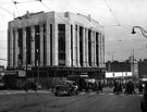 View: s17338 High Street and Market Place junction, Blitz damage (twelve years later) at former Burton Montague Ltd., tailors, Nos. 51 - 55 High Street, also note the temporary C and A Modes Ltd.