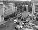 View: s17354 Elevated view of High Street looking towards Commercial Street and Haymarket, Nos. 59 - 65, C and A Modes Ltd. and Yorkshire Bank, left, Barclays Bank (with domed roof), in background