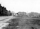 Construction of the Inner Ring Road, Hodgson Street, left (after demolition of courts and back to back housing), Clarence Street, foreground, St. Silas' School, in background