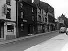 View: s17465 Howard Street, premises include No. 36 Wingfield Rowbotham, cutlery manufacturer, Nos. 38 - 40, C. H. Harrington and Co. Ltd., sheet metal workers, No. 44 T.H. and N. Perkins, bakers, No. 46 The Mary Gentle Cafe