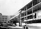 King Street looking towards Market Place, showing construction of new buildings including Pearl Assurance House, Cockaynes, department store, in background