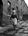Miss Bertha Clark fetching the water for her Latimer Street home