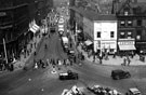 View: s17616 Elevated view of Town Hall Square and Leopold Street, Fargate, right, including No. 70 H.L. Brown and Son Ltd., jewellers (on corner), No. 68 Cantors Ltd., house furnishers, Nos. 66 - 70 A. Wilson Peck and Co. Ltd., music warehouse, left