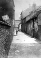 Albion Yard off London Road (between Sheldon Street and Hill Street), at the rear of Albion Hotel, left, old inn and brewhouse, right and slaughterhouse, in background, now demolished