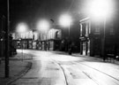 Night view of London Road looking towards junction with Asline Road, premises on right include No. 375 Florence Fowler, butcher and Nos. 363 - 367 A. Leonard and Co., house furnishers