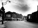 London Road from outside Heeley Palace Cinema (former Heeley Electric Palace), Nos. 579 - 601, H. Ponsford Ltd., house furnishers, in background, Heeley Station, right