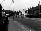 Main Road, Darnall near the junction of Beighton Street (first left) showing No. 271/273, Bennettts of Sheffield Ltd., fishing tackle dealer and No. 281, Doreen Crookes, hairdressers and looking towards Holy Trinity Church in the background