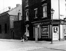 Corner shop, Nos. 75 - 77 Coleridge Road on the corner of Manningham Road, Attercliffe with Brown Bayley's Ltd. in the background