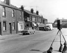 Nos. 117 (extreme left), 119, 121 (hairdressers) and and properties Nos. 121- 131 Meadowhall Road showing the junction with Hayland Street looking towards Brightside Works