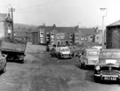 Palace Picture Theatre (extreme left) and car sales pitch, Merton Road looking towards Fife Street (formerly Fowler Street), showing the rear of Nos. 59,57 etc.