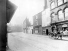 Bow Street, later became West Street showing (right) Nos. 24 - 26 J.W. and J.R. Ellis, ironmongers, right
