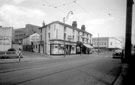 View: s18010 The Moor at junction with Thomas Street, premises include Nos. 134 - 136 The Moor Drapery Stores, Edward Wild and Son Ltd., butchers (Thomas Street Cold Storage), in background
