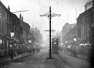 View: s18020 Night view of South Street, Moor, showing gas lamps lit