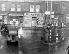 Traffic at The Moor and Ecclesall Road junction showing shops on Ecclesall Road, No. 2 Henry Playfair Ltd., shoe shop, No. 4 Johnson Brothers (Dyers) Ltd. and No. 206 The Moor, Yorkshire Bank Ltd., No. 210 S. Sawer, confectioners