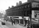 The Moor at junction with Prince Street, Nos. 96 - 98 Willsons (London and Provinces) Ltd., gowns, Nos. 100 - 102 John Collier (Fifty Shilling Tailors Ltd.), Nos. 104 - 108 Henry Wigfall and Son Ltd., cycle dealers
