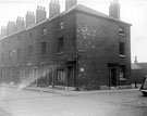Derelict back to back housing, Moore Street at junction with Young Street. Court No. 13, Young Street, at rear of properties