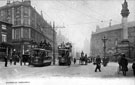 Tram Nos. 18 and 196 at Moorhead looking towards Pinstone Street, T. and J. Roberts, drapers, left, Crimean Monument, right