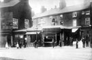 View: s18119 South Street, Moor at Moorhead, shops on site of later G. Binns Ltd., No. 2 Frederick Jones, butcher, No. 4 Thomas Earnshaw, oyster dealer, No. 6 Charles Frederick Copley, hairdresser, No. 8 William Walker, stationer, Button Lane (in background)