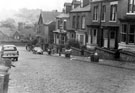 Newington Road looking towards Brocco Bank and rear of the George Woofindin Almshouses, shows 10 day old refuse following Whit holiday