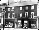 Norfolk Street, near Arundel Street, No. 87 E.F. Jones, tobacconist, No. 89 Walter F. Brown, jewellers, Nos. 91 and 93 Hy. Outram, confectioner