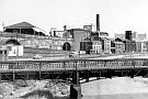 Nursery Street taken from Corporation Street Bridge (Borough Bridge) showing The Iron Bridge, part of Bridgeghouses Goods Station, Jn Aizelwood Ltd., Crown Corn Mill, Manchester Hotel, Holy Trinity Church with Hyde Park Flats in the background