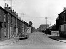 Paget Street looking towards Sanderson Street and St. Clements Mission Hall (left) with Newhall County School opposite and River Don Works Gun Shop in the background