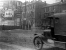 View: s18603 Traffic sign for the A61 at the junction of Paternoster Row and Leadmill Road, premises of Arthur Davy and Sons, provision merchants, in background